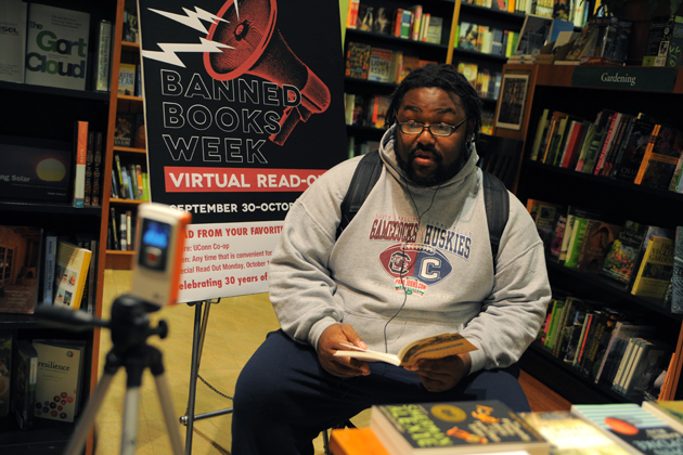 Taurean Stovall '13 (SFA) reads from John Steinbeck's 'Of Mice and Men' during Banned Books Week at the UConn Co-op in 2012. (Max Sinton/UConn Photo)