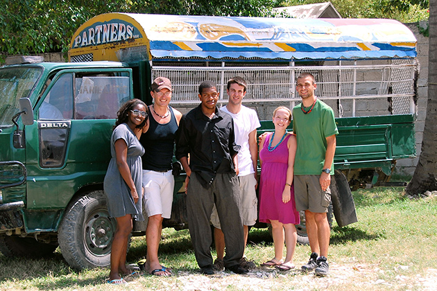 Professor Thomas Craemer, second from left, traveled to Haiti last year with UConn students (from left) Marissa Mack, Omar Green, Parker Sorenson, Caty Wagner, and Patrick Turek, shown here in front of a 'tap-tap' (pick-up truck) owned by Partners in Development. (Photo courtesy of Patrick Turek)