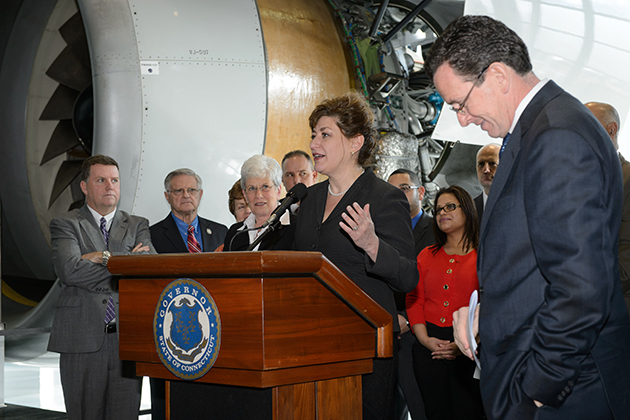 Gov. Malloy, right, and other dignitaries listen as President Susan Herbst speaks about the Next Generation Connecticut initiative. (Peter Morenus/UConn Photo)