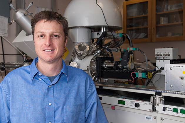 Brian Willis, associate professor of chemical, materials, and biomolecular engineering, in his lab, with an X-ray photoelectron spectrometer. (Sean Flynn/UConn Photo)