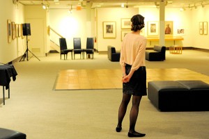 Assistant curator Ally Walton surveys the scene at the Benton before the Gatsby speakeasy party on March 1. (Max Sinton '15 (CANR)/UConn Photo)