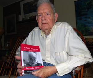 Director emeritus of University Libraries Norman Stevens, with Francelia Butler's autobiography, which he edited. (Suzanne Zack, UConn Photo)