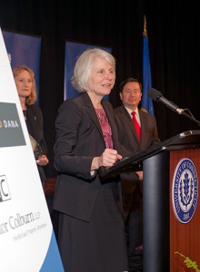 DECD Commissioner Catherine Smith accepts her Innovations Champion award as UConn's Vice President of Economic Development Mary Holz-Clause and Provost and Executive Vice President Mun Choi look on. (Tom Hurlbut for UConn)