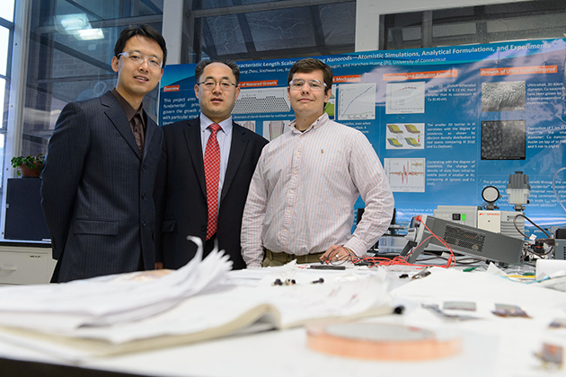 Xiaobin Niu, assistant research professor, left, Hanchen Huang, Connecticut Clean Energy Fund Professor in Sustainable Energy, and Stephen Stagon a doctoral student of mechanical engineering, at their lab at the Longley Building on April 23, 2013. (Peter Morenus/UConn Photo)