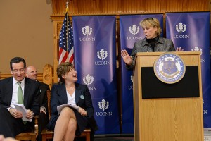 Lori Pelletier, right, secretary-treasurer of the Connecticut AFL-CIO, speaks at the event. At left are Gov. Dannel Malloy and President Susan Herbst. (Peter Morenus/UConn Photo)