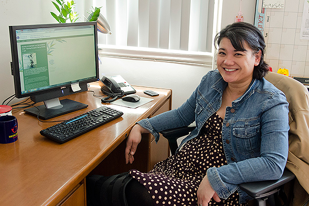 Cathy Schlund-Vials, associate professor of English and director of the Asian-American Studies Institute, in her office in Beach Hall. (Ariel Dowski '14 (CLAS)/UConn Photo)