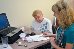 Dietitian Anna Garrett provides a nutrition consultation to a study volunteer. (Tina Encarnacion/UConn Health Center Photo)