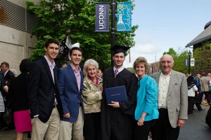 Brian Petroccio '13 (BUS) with his family after the School of Business Commencement ceremony held at Gampel Pavilion on May 12, 2013. (Ariel Dowski '14 (CLAS)/UConn Photo)