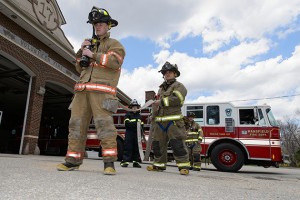 A handful of UConn students learned professional firefighting skills while helping out in the community as volunteers with the Mansfield Fire Department. (Peter Morenus/UConn Photo)