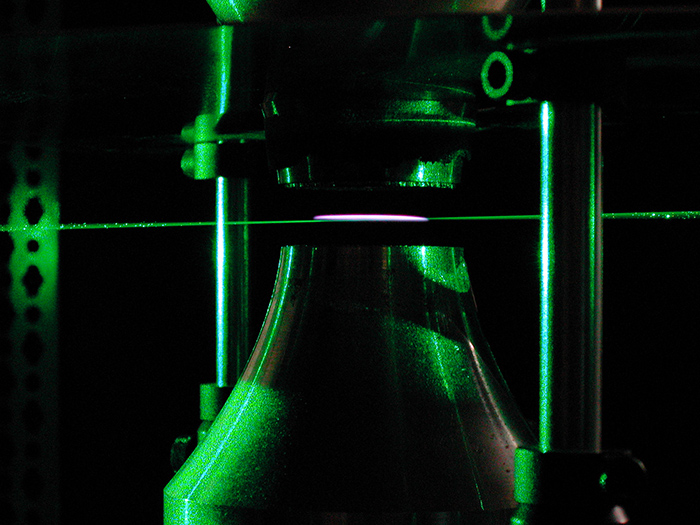 A pulsed laser is used to measure the temperature at the point where a laminar flame is extinguished. (Image courtesy of Michael Renfro)