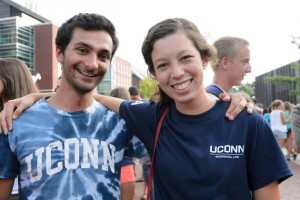 Lior Trestman '15 and Alexandra Buda '14 share 'what I did on my summer vacation' stories at the Husky Wow Barbecue. (Peter Morenus/UConn Photo)