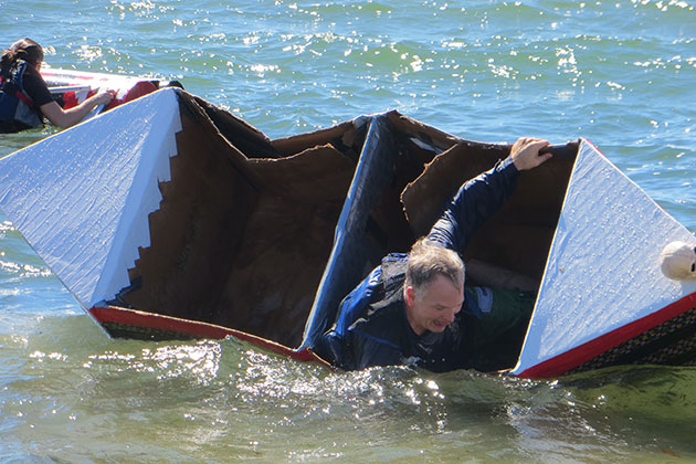 Avery Point Campus director Mike Alfultis takes a spill during the cardboard boat race. (Noreen Blaschik/UConn Photo)