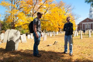 Peter Leach, teaching assistant for associate professor Kevin McBride, conducts an Introduction to Archeology class at the Storrs Cemetery. (Sean Flynn/UConn Photo)
