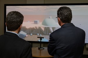 Horea Ilies, left, associate professor of mechanical engineering, shows a virtual reality demonstration to Gov. Malloy after a ceremony on campus in October to celebrate the Next Generation Connecticut initiative. (Peter Morenus/UConn Photo)