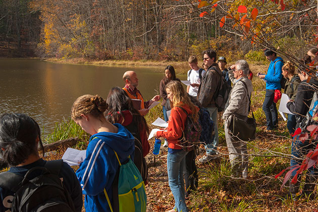 Robert Thorson, professor of ecology and evolutionary biology, addresses an honors class during a field trip to Tift Pond in the Albert E. Moss Sanctuary. (Sean Flynn/UConn Photo)