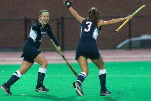 Chloe Hunnable '15 (CLAS), left, and Marie Elena Bolles '14 (NUR) after combining for the winning goal in the Huskies' 1-0 overtime victory for the Big East Championship. (Steve Slade '89 (SFA) for UConn)