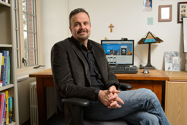 Bradley Wright, associate professor of sociology, oversees a new project that is gathering real-time data on Americans' spirituality. (Peter Morenus/UConn Photo)