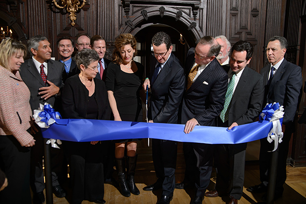 Governor Dannel P. Malloy, center, cuts a ceremonial ribbon at an event to announce the launch of the Institute for Community Resiliency and Climate Adaptation held on Jan. 24, 2014 at the Branford House at the University of Connecticut Avery Point campus in Groton. (Peter Morenus/UConn Photo)