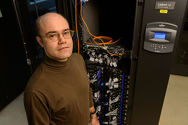 Serge Nakhmanson, associate professor of chemical, materials, &amp; biomolecular engineering, in a server room at the Taylor L. Booth Engineering Center for Advanced Technology. (Peter Morenus/UConn Photo)