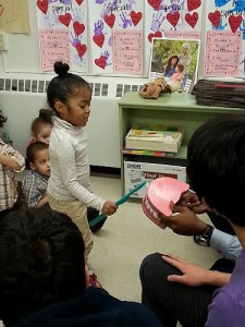UST scholars work with children at ÒBrushing BunnyÓ program events in an effort to improve their oral health. (Photos provided by Petra Clark-Dufner)