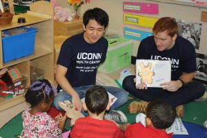 UST scholars work with children at "Brushing Bunny" program events in an effort to improve their oral health. (Photos provided by Petra Clark-Dufner)