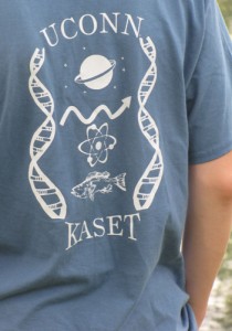 Nicholas Michel, a participant in the Magnificent Microbes program, models the KASET program t-shirt that sports the new logo. The program has added an E for Engineer to it's name: Kids are Scientists and Engineers, Too. (Sheila Foran/UConn Photo)