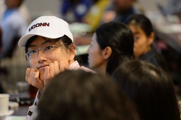 Zhongyang Li, assistant professor of mathematics, listens to a presentation during the new faculty orientation on Aug. 21. (Peter Morenus/UConn Photo)