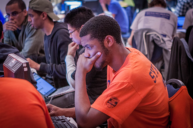 The team from Syracuse University hacks away for classified files in the Capture the Flag competition, during a two-day cybersecurity conference organized by the Center of Excellence for Security Innovation, a partnership between Comcast and the UConn School of Engineering's Center for Hardware Assurance, Security, and Engineering. (Christopher LaRosa/UConn Photo)
