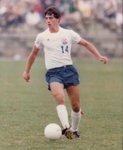 Tony Rizza ’87 (BUS) playing soccer. He was on the UConn men's soccer team from 1983 to 1986. (Division of Athletics/UConn File Photo)