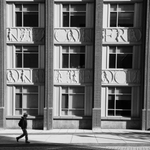 A student walks in front of the John W. Rowe Center for Undergraduate Education. (Peter Morenus/UConn Photo)