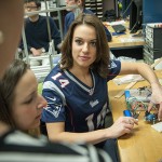 Alyssa Merkle '15 (ENG), Patriots cheerleader, works on her senior project in engineering. (Sean Flynn/UConn Photo)