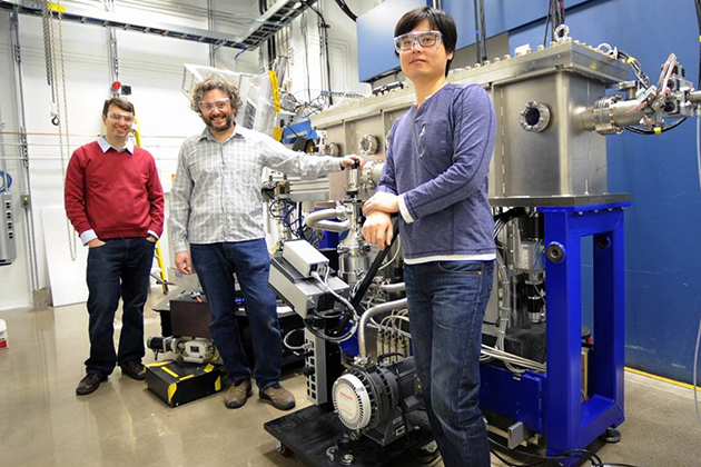 From left, Jason Hancock, assistant professor of physics, Diego Casa, and Jung-ho Kim, with one of the instruments used in the experiment. (Argonne National Laboratory Photo) 