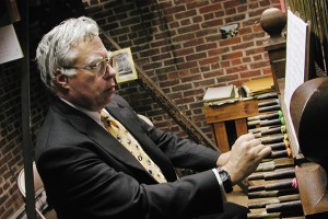 Associate professor David Maker, now emeritus, plays the carillon at Storrs Congregational Church in 2000. (Shannon McAvoy/UConn Photo)
