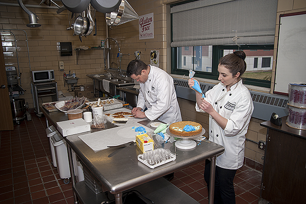 Rob Landolphi, left, and Kristina Breuninger of Dining Services prepare desserts in the dedicated gluten-free kitchen. (Sean Flynn/UConn Photo)