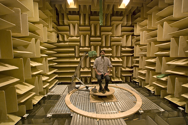 A human subject in an anechoic (echo-free) chamber at UConn Health. (Photo courtesy of Duck Kim)