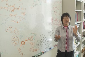 Jinbo Bi, associate professor of computer science and engineering, discusses her research. (Sean Flynn/UConn Photo)