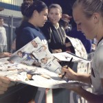 Rachel Hill, women's soccer, signs autographs. (Bret Eckhardt/UConn Photo)