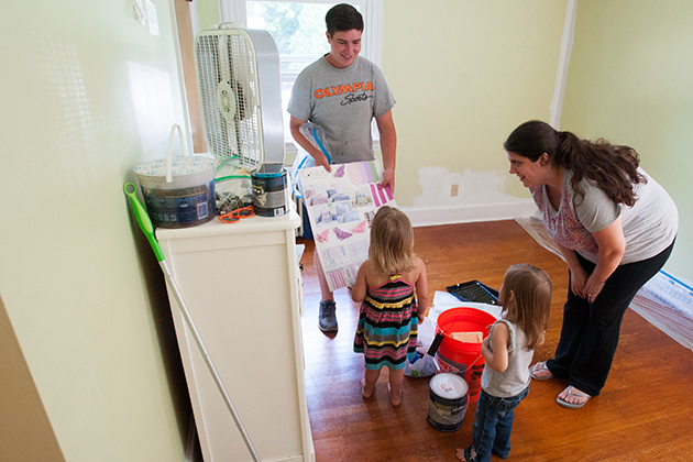 Three year old, Gracie, during a room make-over by Jonathan Markovics who was funded by an Idea Grant on Aug. 7, 2015. (sean flynn/UConn Photo)