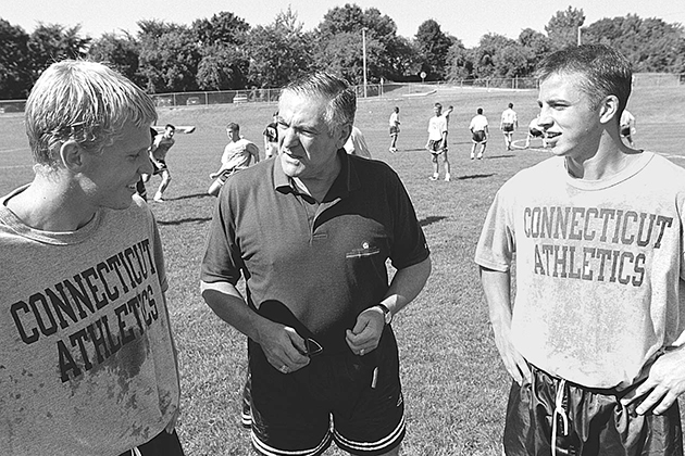 Joseph Morrone, center, men's soccer head coach, speaks with players Steve Chirgwin, left, and Bobby Rhine in 1996. (Peter Morenus/UConn Photo)