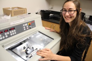 Miryam Wilson '15 (CLAS), uses a cryostat to prepare sections of mouse brain for study. Wilson is now a first-year student at the UConn School of Medicine. (Christine Buckley/UConn Photo)