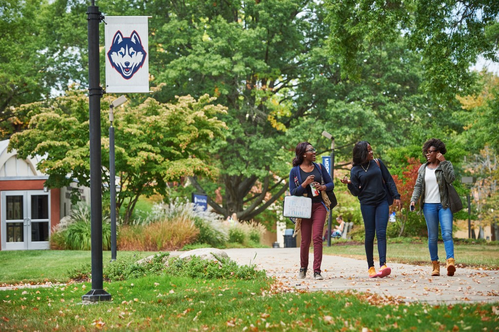 Students walk outdoors at the current Hartford campus. (Peter Morenus/UConn Photo)