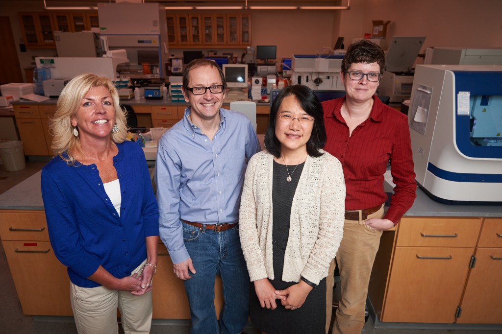 Susan Janton, left, Joerg Graf, Xiaomei Cong, and Kendra Maas, at the Microbial Analysis, Resources and Services lab. (Peter Morenus/UConn Photo)