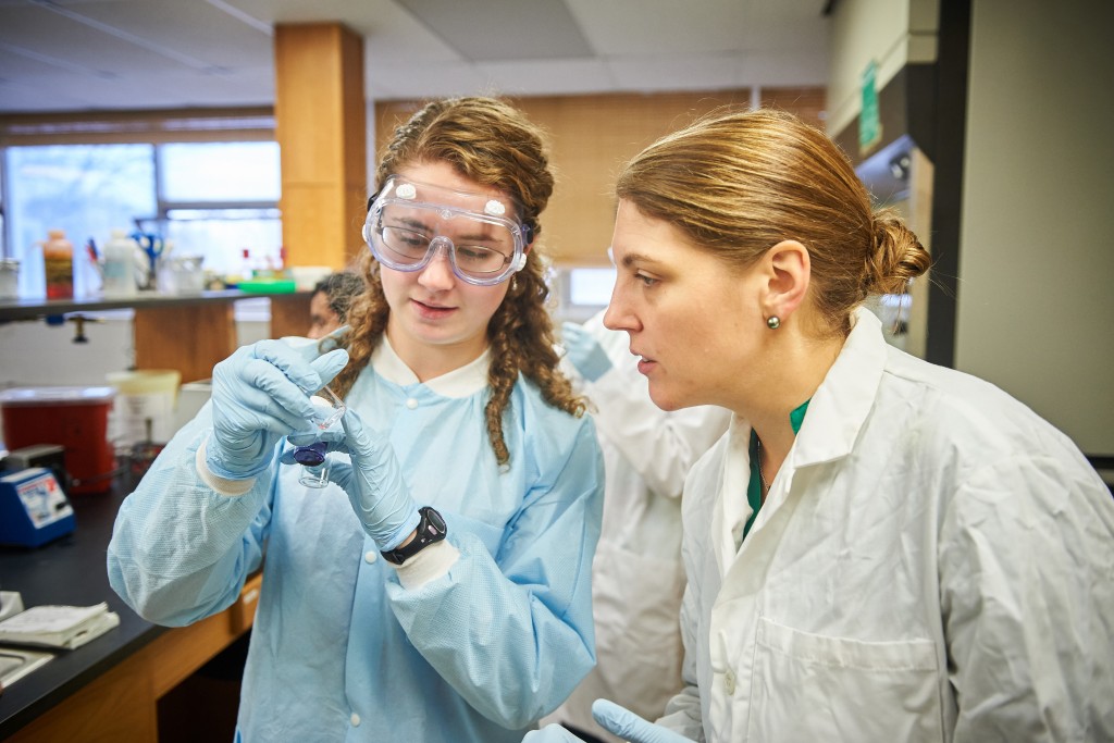 Katherine Bell '19 (CLAS), left and Nichole Broderick, assistant professor of molecular and cell biology, looks at vials of collected bacteria in a microbiology lab at the Torrey Life Sciences Building on Nov. 10, 2015. (Peter Morenus/UConn Photo)