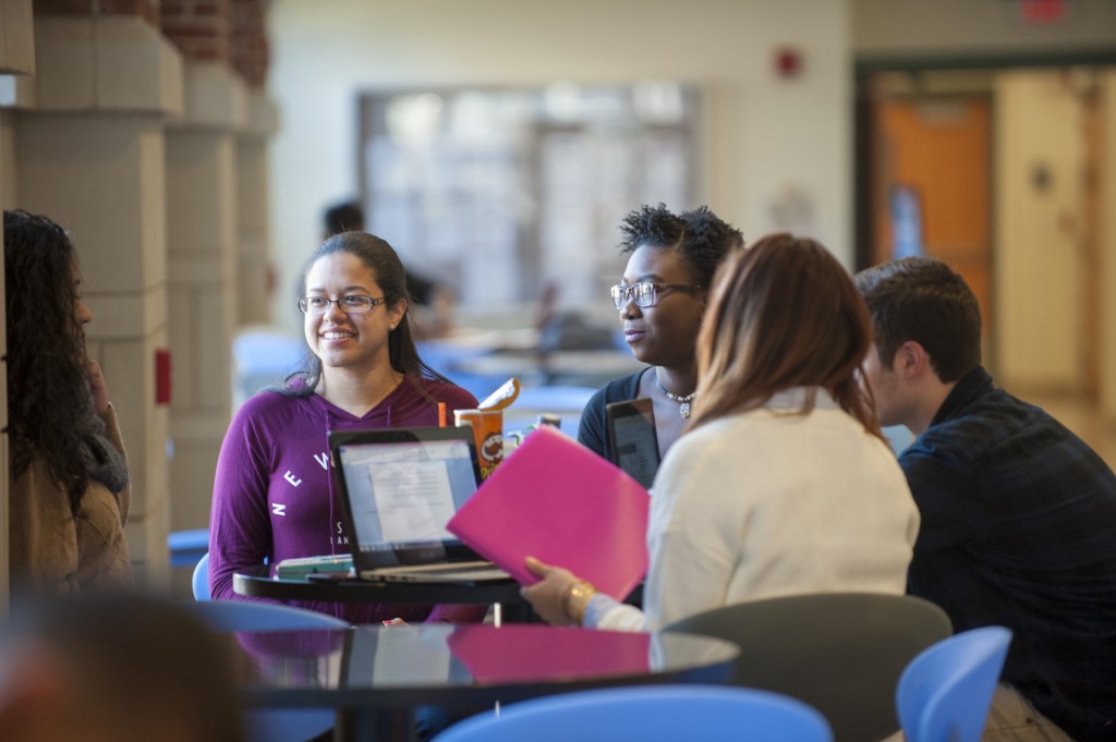 A group of students discussing class work. (Sean Flynn/UConn Photo)