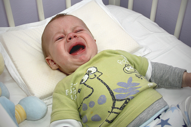 A baby crying. UConn researchers are investigating how the brain distinguishes the sounds made in communication. (iStock Photo)