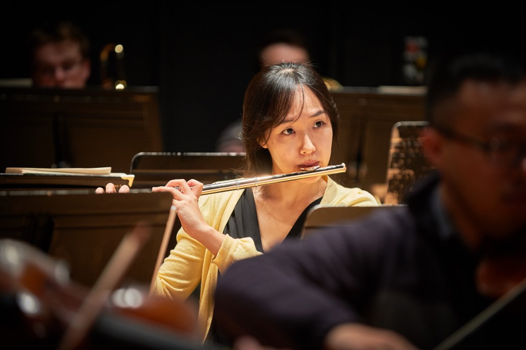Graduate student Hyejin Bae plays flute during a rehearsal of the University Symphony Orchestra at von der Mehden Recital Hall on Nov. 16, 2015. (Peter Morenus/UConn Photo)