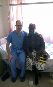 Dr. Isaac Moss, UConn Health orthopaedic spine surgeon, with a patient at Kenyatta National Hospital in Nairobi, Kenya. (Photo provided by Dr. Isaac Moss).
