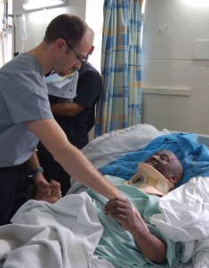 Dr. Isaac Moss, UConn Health orthopaedic spine surgeon, with a patient at Kenyatta National Hospital in Nairobi, Kenya. (Photo provided by Dr. Isaac Moss).