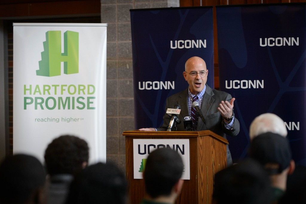 Hartford Promise Executive Director Richard Sugarman speaks during Hartford Promise announcement held at Mark Twain branch of the Hartford Public Library at Hartford Public High School on Jan. 12, 2016. (Peter Morenus/UConn Photo)