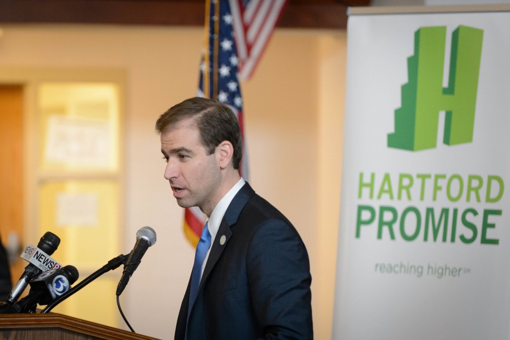 Mayor Luke Bronin speaks during the Hartford Promise announcement held at Mark Twain branch of the Hartford Public Library at Hartford Public High School on Jan. 12, 2016. (Peter Morenus/UConn Photo)
